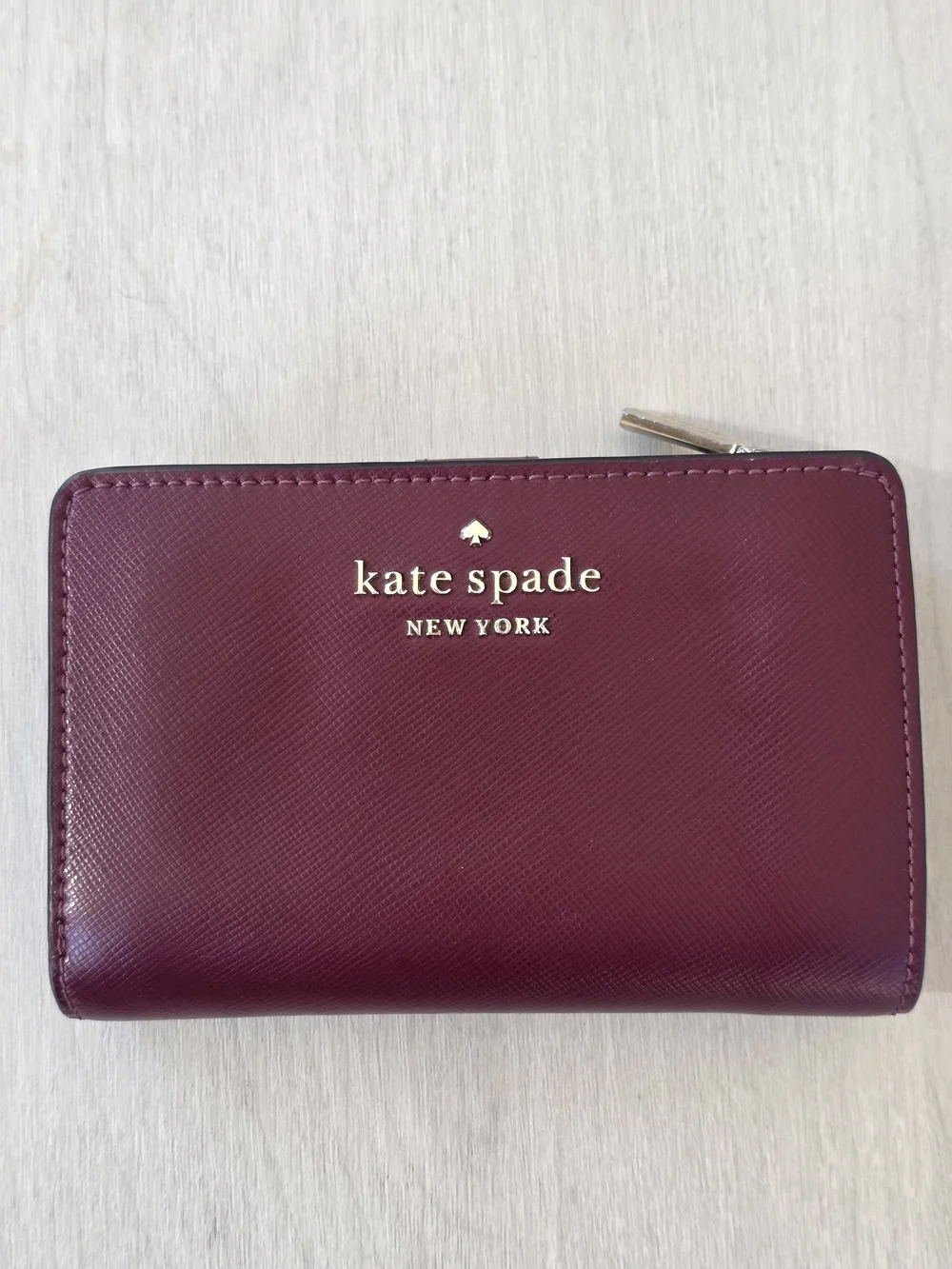 Kate Spade Staci Medium Bifold Wallet in a Deep Berry